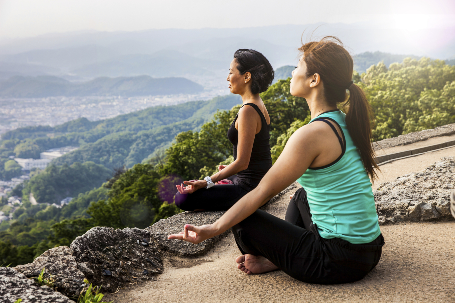 Women in meditation, doing Yoga in Japan