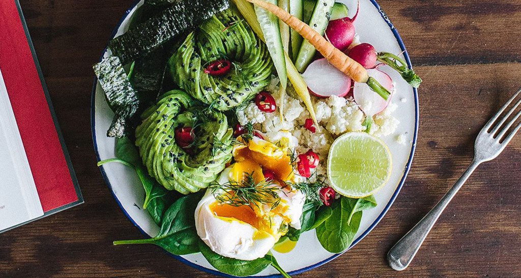 Plate with avocado, eggs, and other nutritious foods