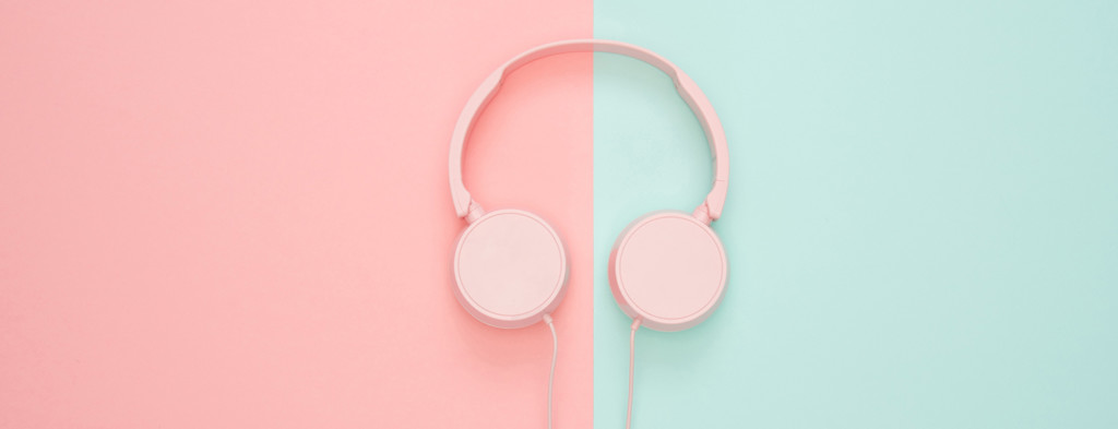 Headphones on pink and blue background