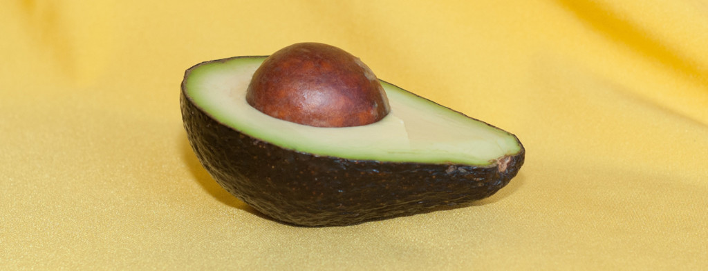 Avocado on yellow background