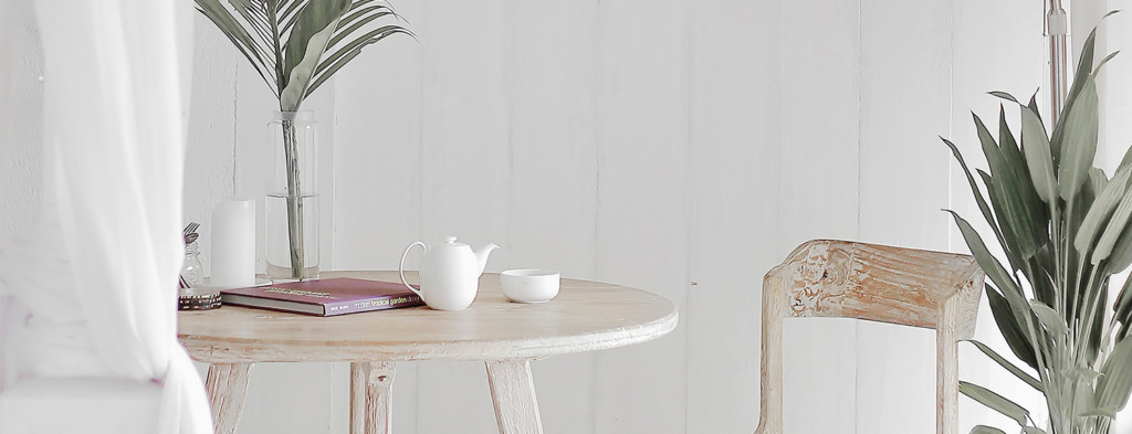 Wooden chair and table with white teapot