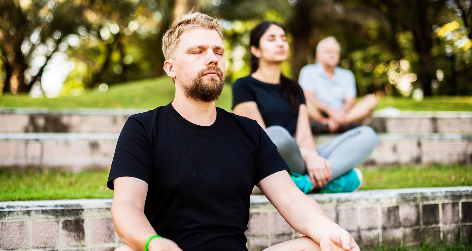Man inhaling during meditation practice
