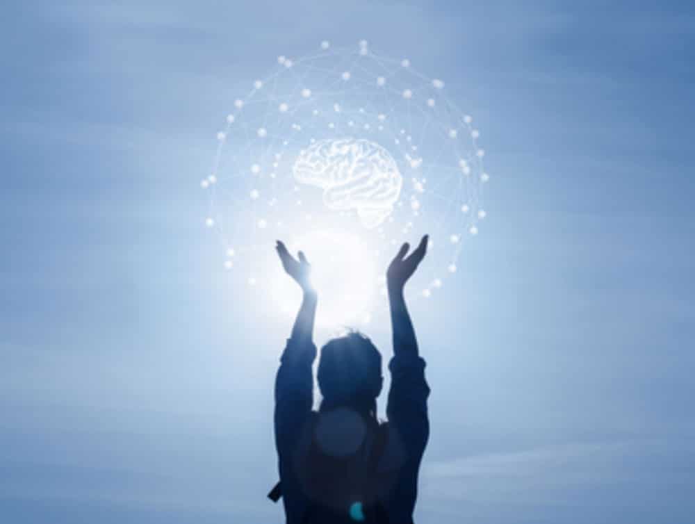 Bioquantum Skin Care image of a person holding up a graphic of a brain