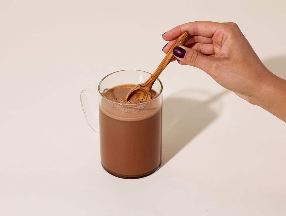 Paleo Valley Chocolate Bone Broth Protein Powder mixed into a drink