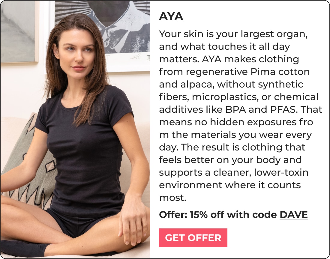 A woman with long brown hair sits on a couch wearing a black T-shirt and shorts. Next to her is text about AYA clothing, made from regenerative materials inspired by biohacking products, plus a 15% off offer with code DAVE and a pink Get Offer button.