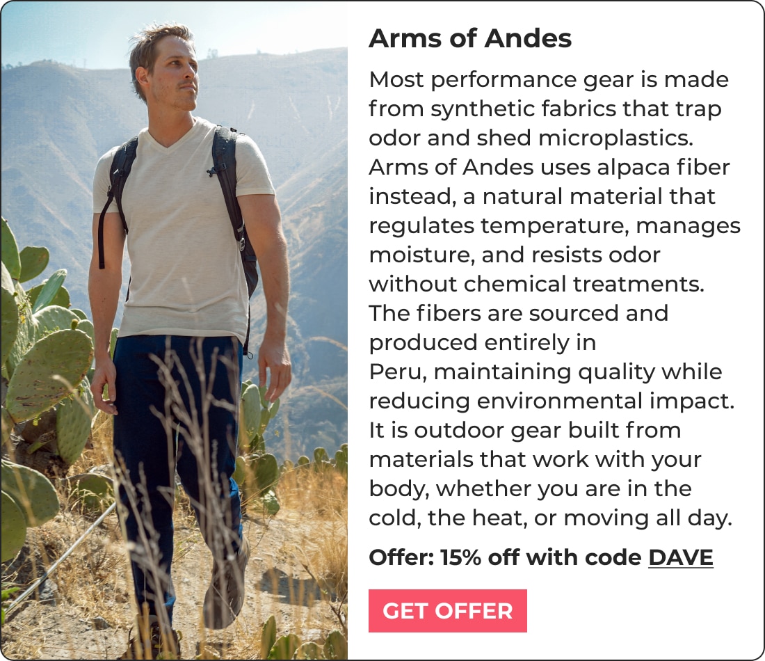 A man wearing a gray t-shirt and backpack walks outdoors on a trail near cacti, with mountains in the background. Text promotes Arms of Andes biohacking products and offers 15% off with code DAVE.