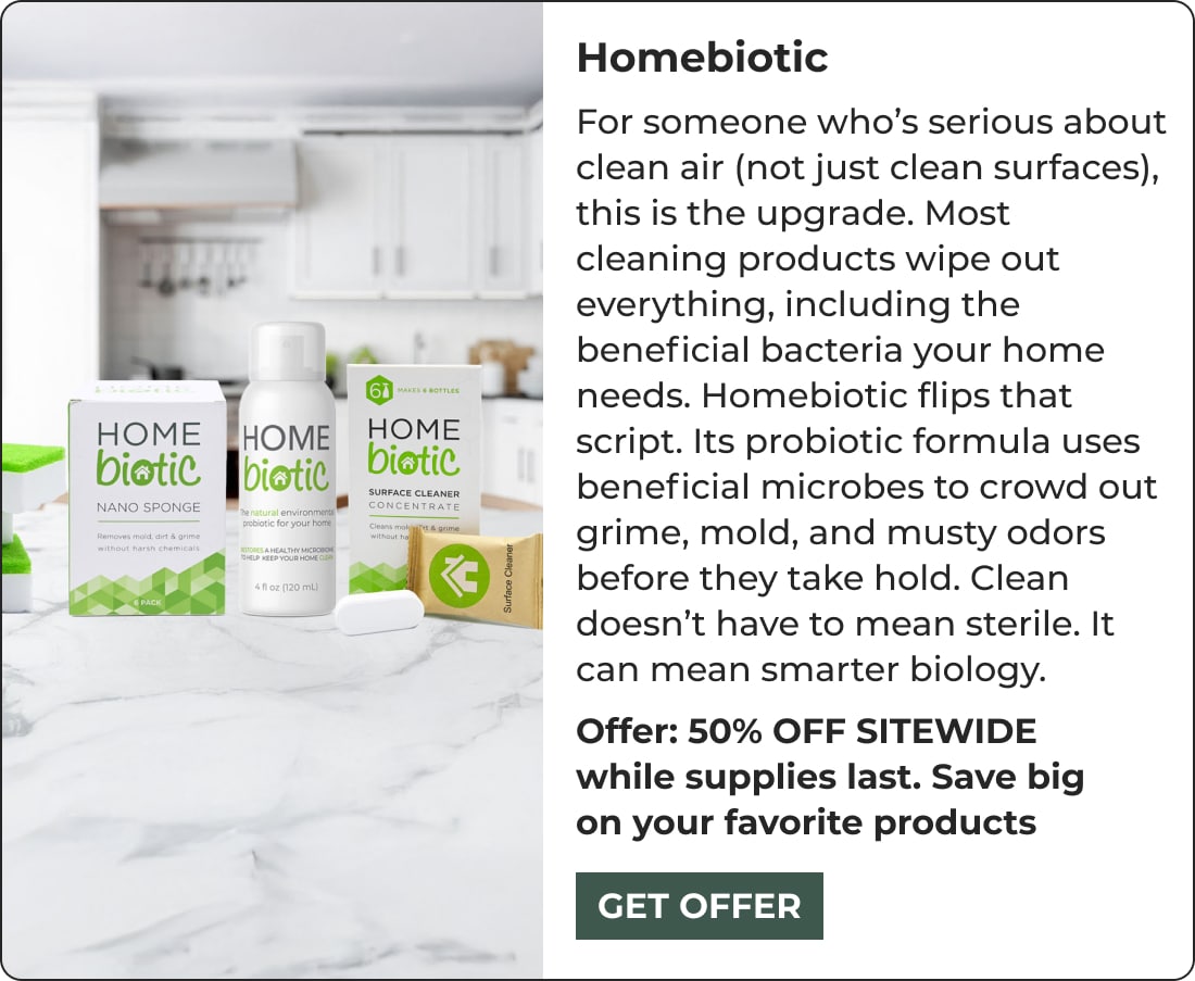 A promotional image for Homebiotic, featuring bottles and a box of cleaning products on a kitchen counter. Text highlights these biohacking products use beneficial microbes for a healthier home, with an offer for 50% off sitewide.