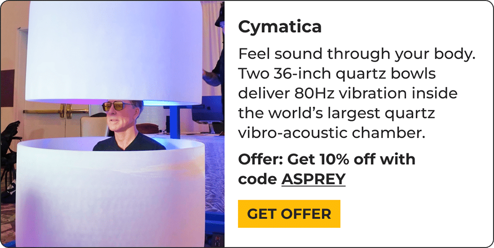 A person sits inside large stacked quartz bowls for a vibro-acoustic therapy session. Discover 2026 biohacking products: get 10% off Cymatica with code ASPREY. Tap Get Offer to upgrade your wellness.