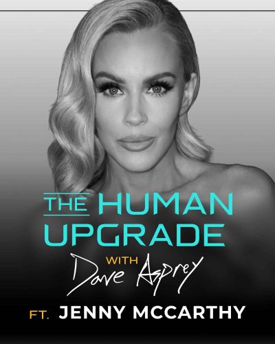 Black and white photo of a woman with wavy hair. Text: The Human Upgrade with Dave Asprey ft. Jenny McCarthy. The woman is looking directly at the camera with a neutral expression.