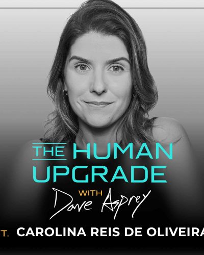A woman with wavy hair smiles slightly. Text: The Human Upgrade with Dave Asprey ft. Carolina Reis de Oliveira. The image is in grayscale with blue and white text.