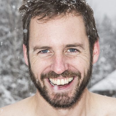 Photo of Scott Carney in the snow with no shirt