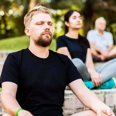 Man inhaling during meditation practice