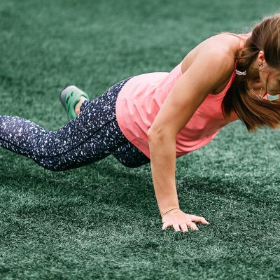 Woman doing burpees outside