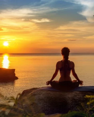 yoga-practicing-at-sunset-meditation-559454563